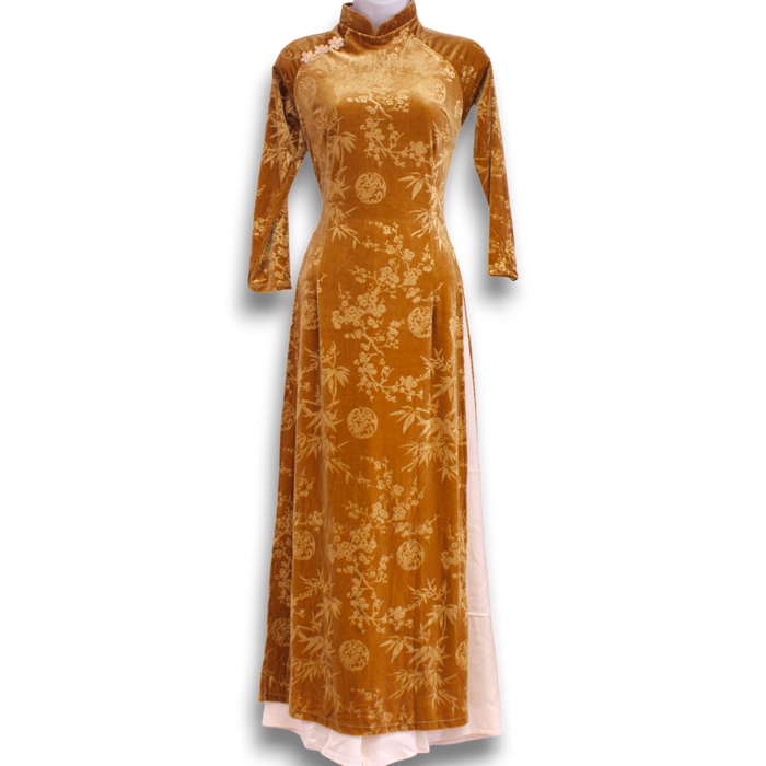 Brown-yellow velvet dress with floral pattern on a white background