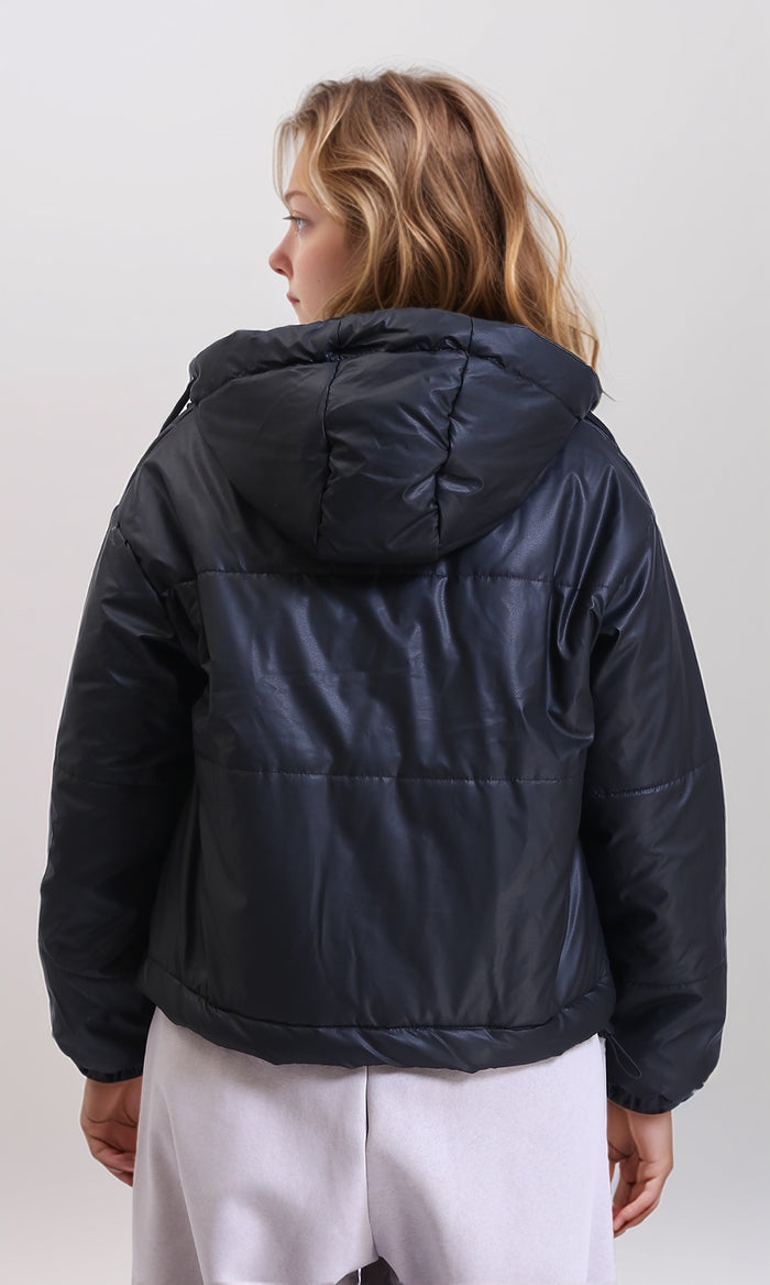 Person wearing a black puffer jacket on a white background