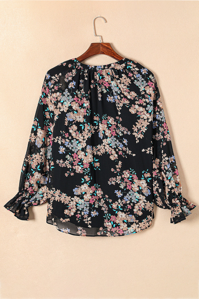 Blouse noire en mousseline à imprimé fleurs sauvages