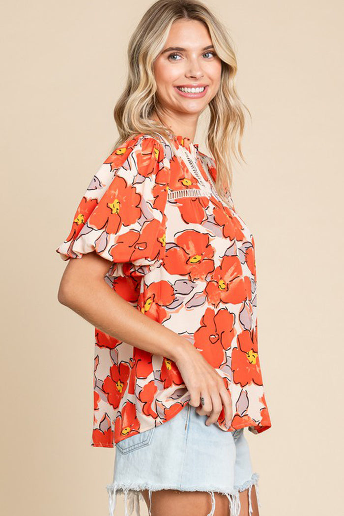 Chemisier ample orange à manches bouffantes et col volanté et motif floral-A WOMAN WE LOVE