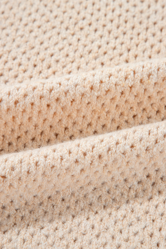 Pull ample à col en V et épaules tombantes avec œillets