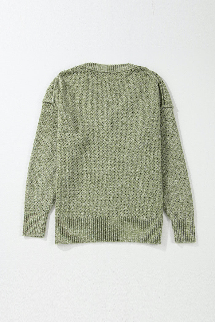 Pull ample à œillets vert jungle, col en V, épaules tombantes