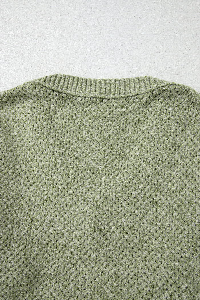 Pull ample à œillets vert jungle, col en V, épaules tombantes