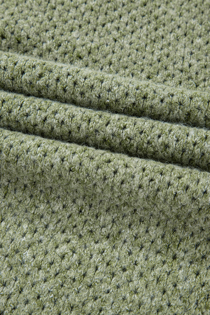 Pull ample à œillets vert jungle, col en V, épaules tombantes
