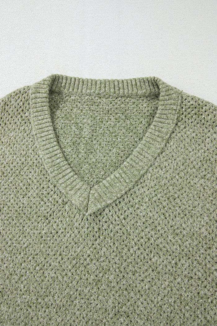Pull ample à œillets vert jungle, col en V, épaules tombantes