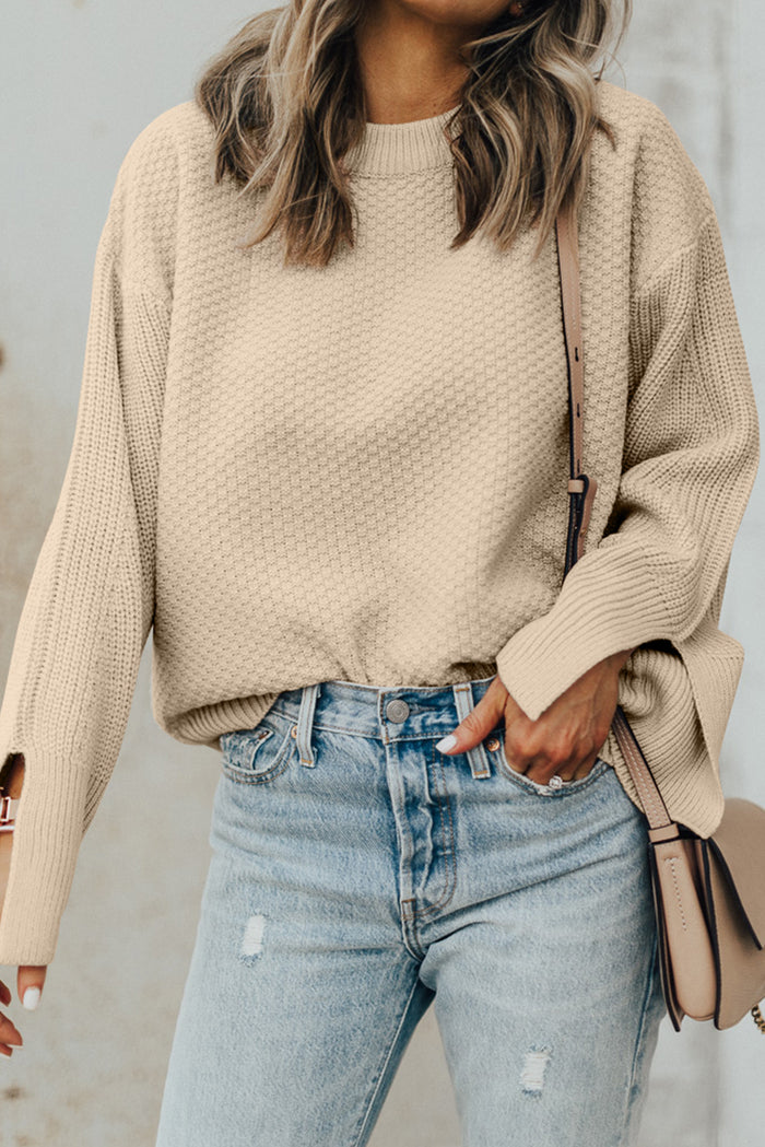 Pull ample en tricot texturé uni parchemin avec poignets fendus*