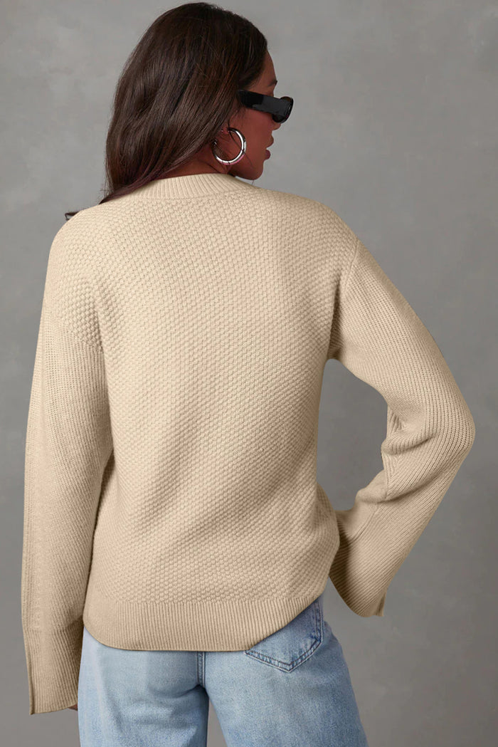 Pull ample en tricot texturé uni parchemin avec poignets fendus*