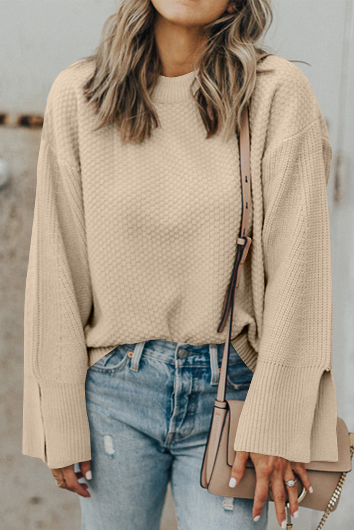 Pull ample en tricot texturé uni parchemin avec poignets fendus*