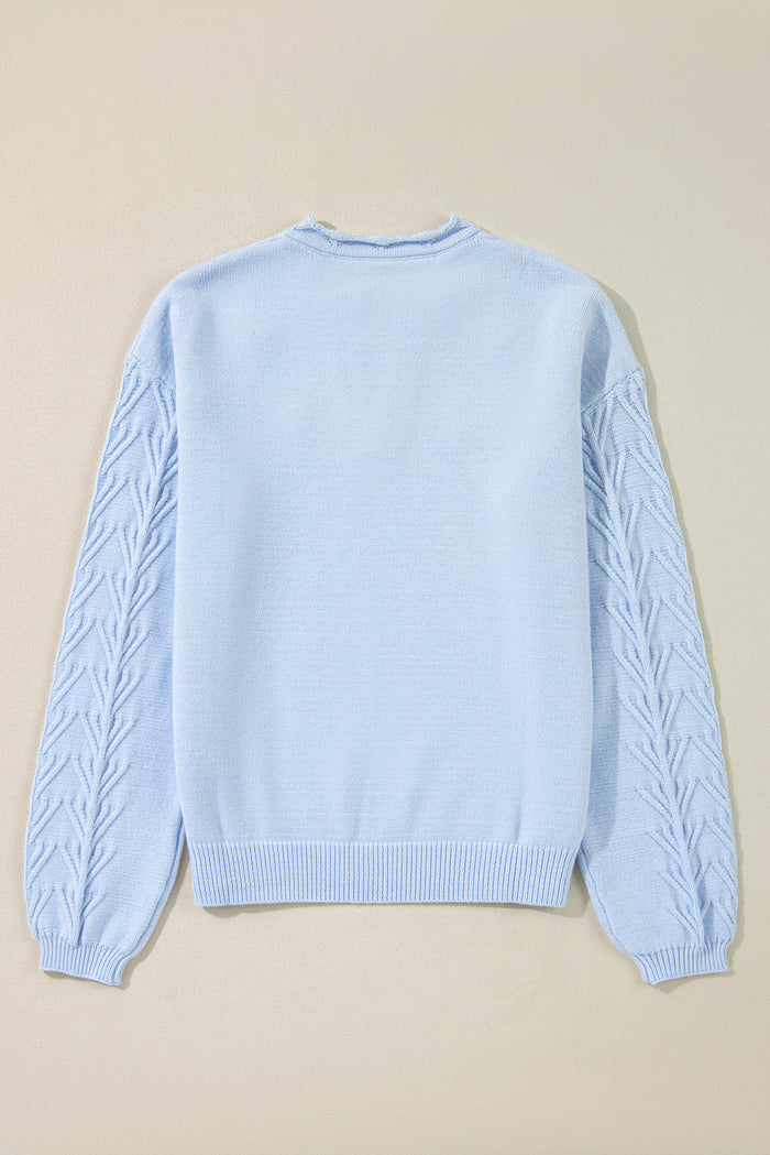 Pull tricoté à col cranté et détail de fleurs *
