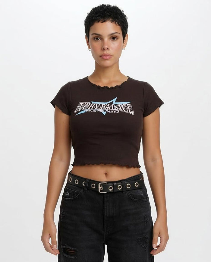 Person wearing a black t-shirt with a logo and black pants on a white background