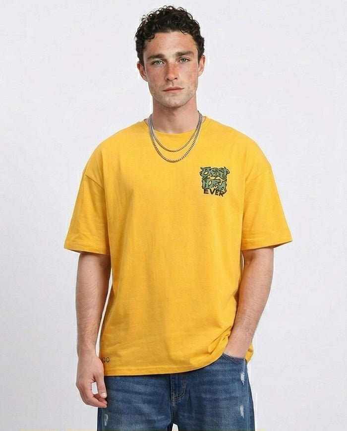 Man wearing a yellow t-shirt with a logo on a white background