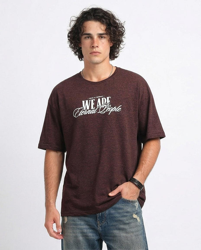 Man wearing a brown t-shirt with text on a white background