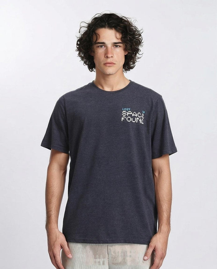 Man wearing a dark gray t-shirt with text on a white background