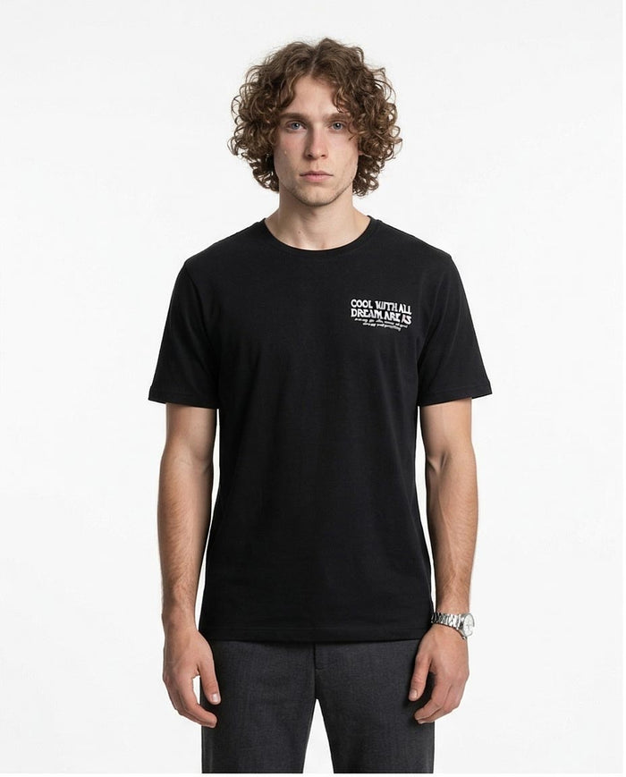 Man wearing a black t-shirt with text on a white background