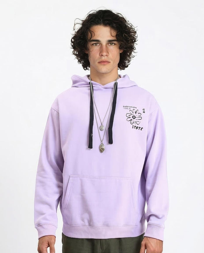Person wearing a light purple hoodie with a graphic design on a white background