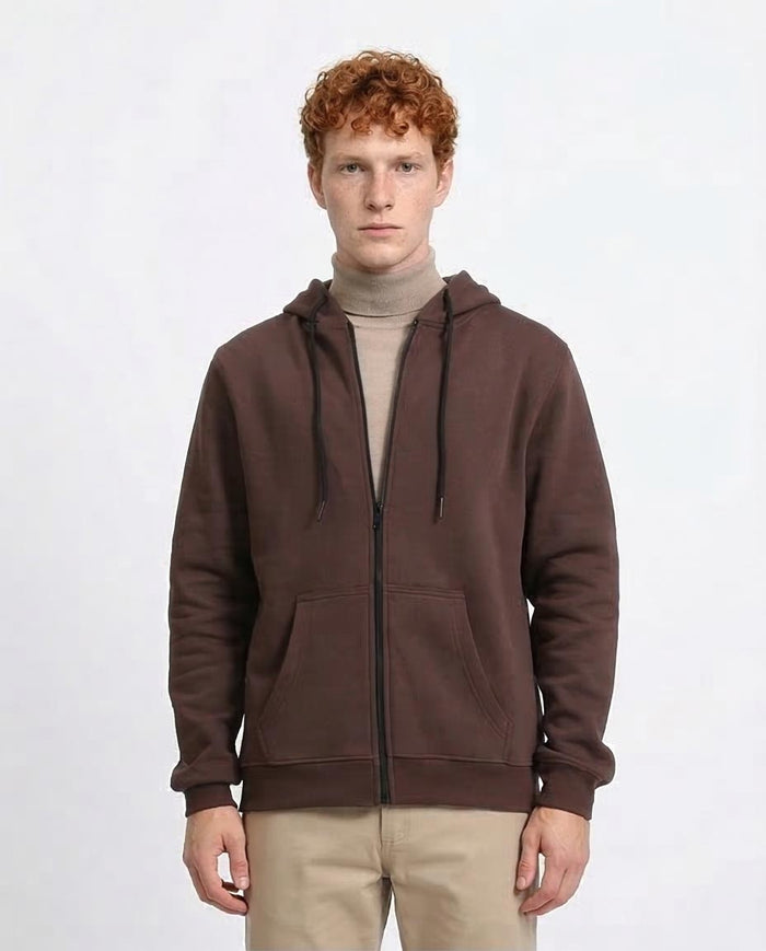 Man wearing a brown hoodie on a white background