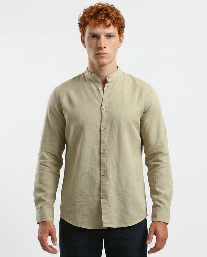 Man wearing a beige long-sleeve shirt on a white background