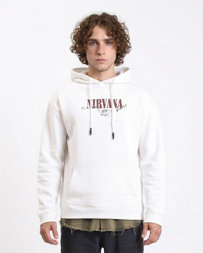 Person wearing a white hoodie with 'Nirvana' logo on a white background