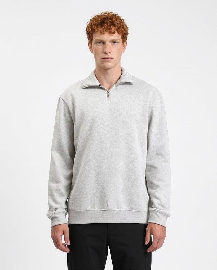 Man wearing a gray sweatshirt on a white background