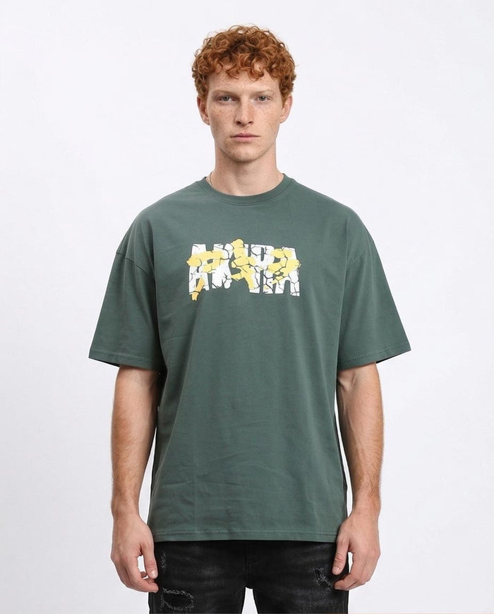 Man wearing a green t-shirt with a graphic design on a white background