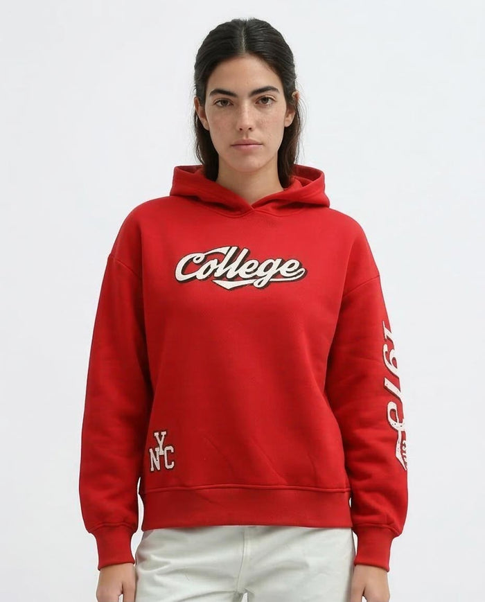 Woman wearing a red hoodie with 'College' text on a white background