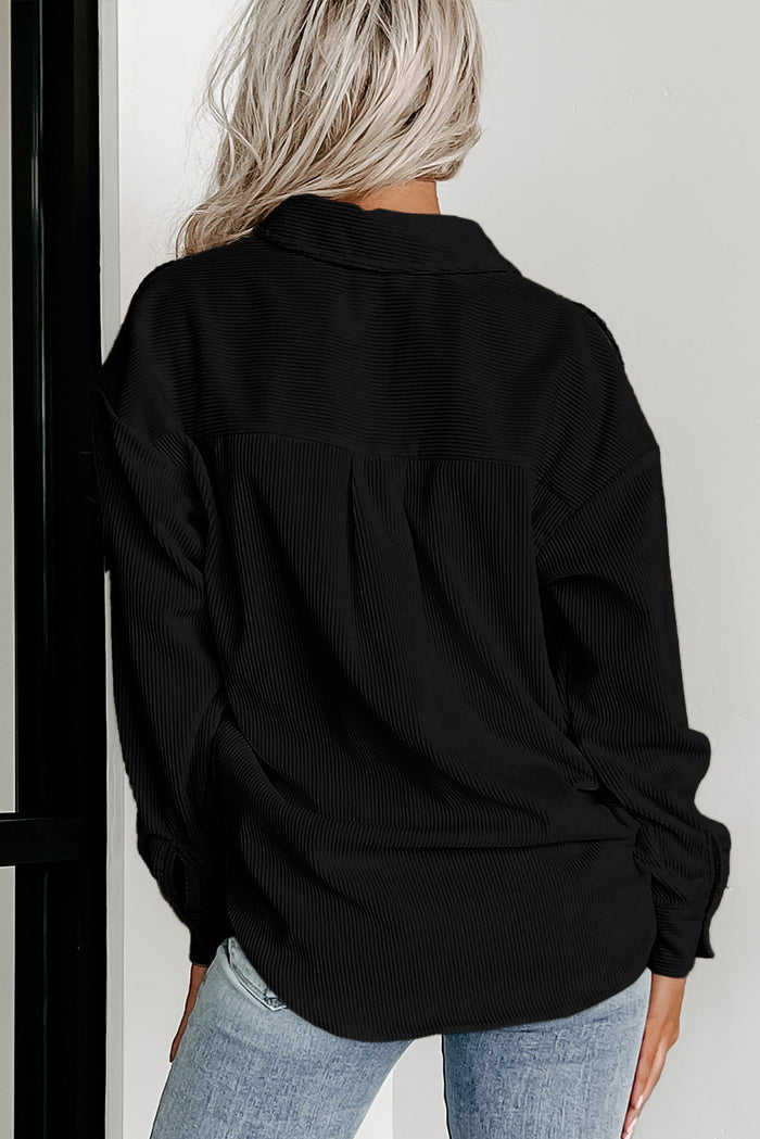 Veste courte noire en velours côtelé pied-de-poule *