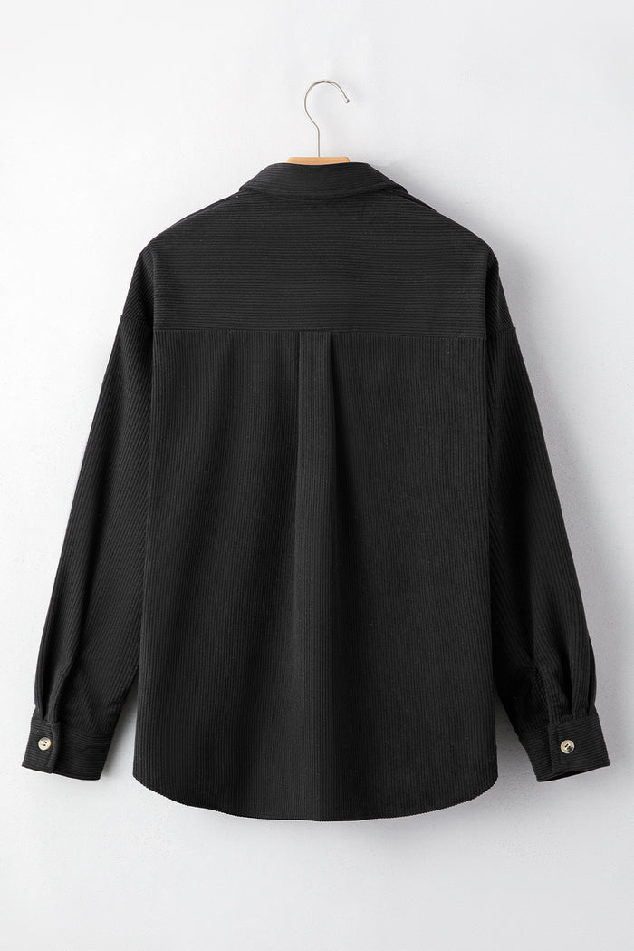 Veste courte noire en velours côtelé pied-de-poule *