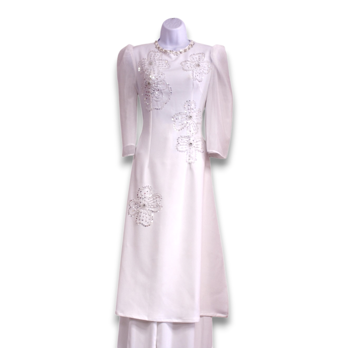 White embroidered ao dai dress on a mannequin against a white background